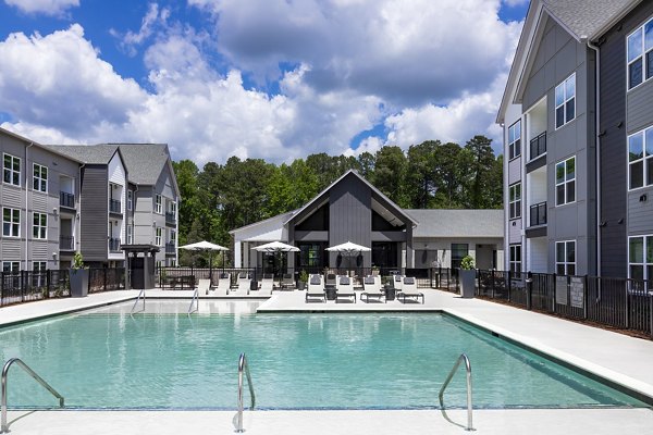 Resort-style pool with lounging area at Milo Apartments, offering Greystar luxury amenities in a vibrant community setting