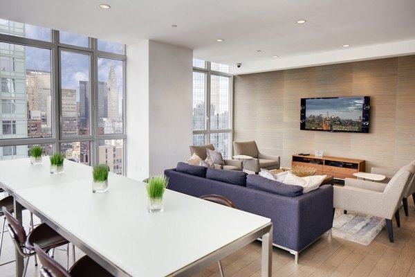 The Dylan Apartments: Stylish clubhouse with modern furnishings and open seating areas in luxury apartments