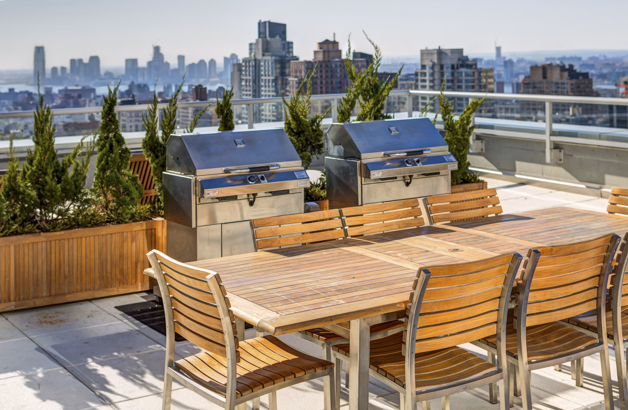 Outdoor grilling area with modern seating at The Dylan Apartments, a luxury property by Greystar in vibrant neighborhood