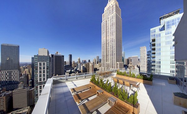 The Dylan Apartments: Luxury rooftop deck offering scenic views in New York, NY.