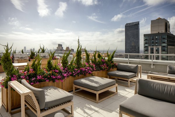 The Dylan Apartments: Scenic rooftop deck with city views, perfect for relaxation and gatherings