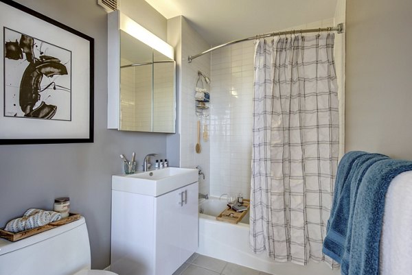 Contemporary bathroom with marble accents at The Octagon Apartments