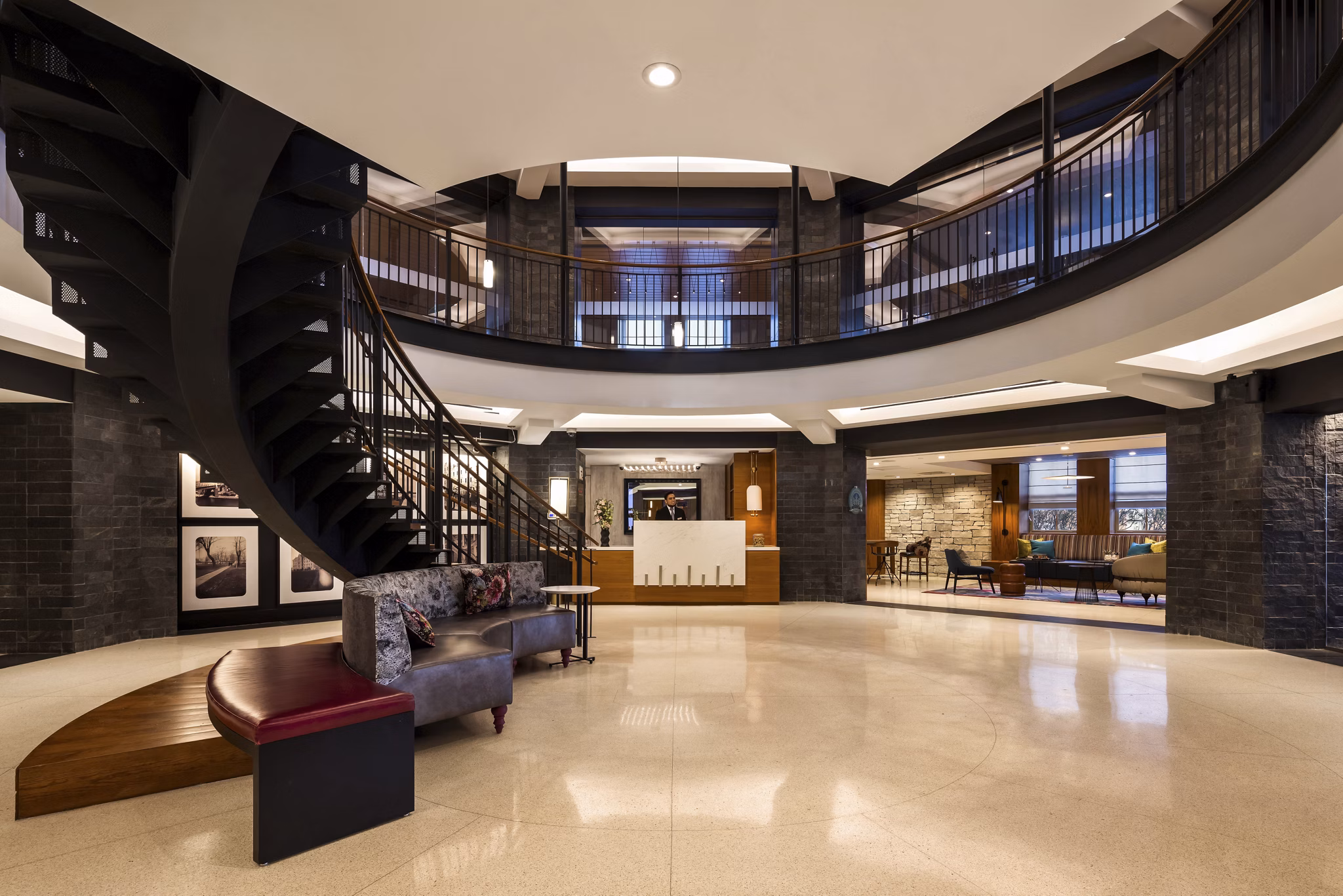 Modern clubhouse featuring extensive seating and entertainment areas at The Octagon Apartments