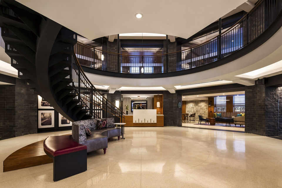 Modern clubhouse featuring extensive seating and entertainment areas at The Octagon Apartments
