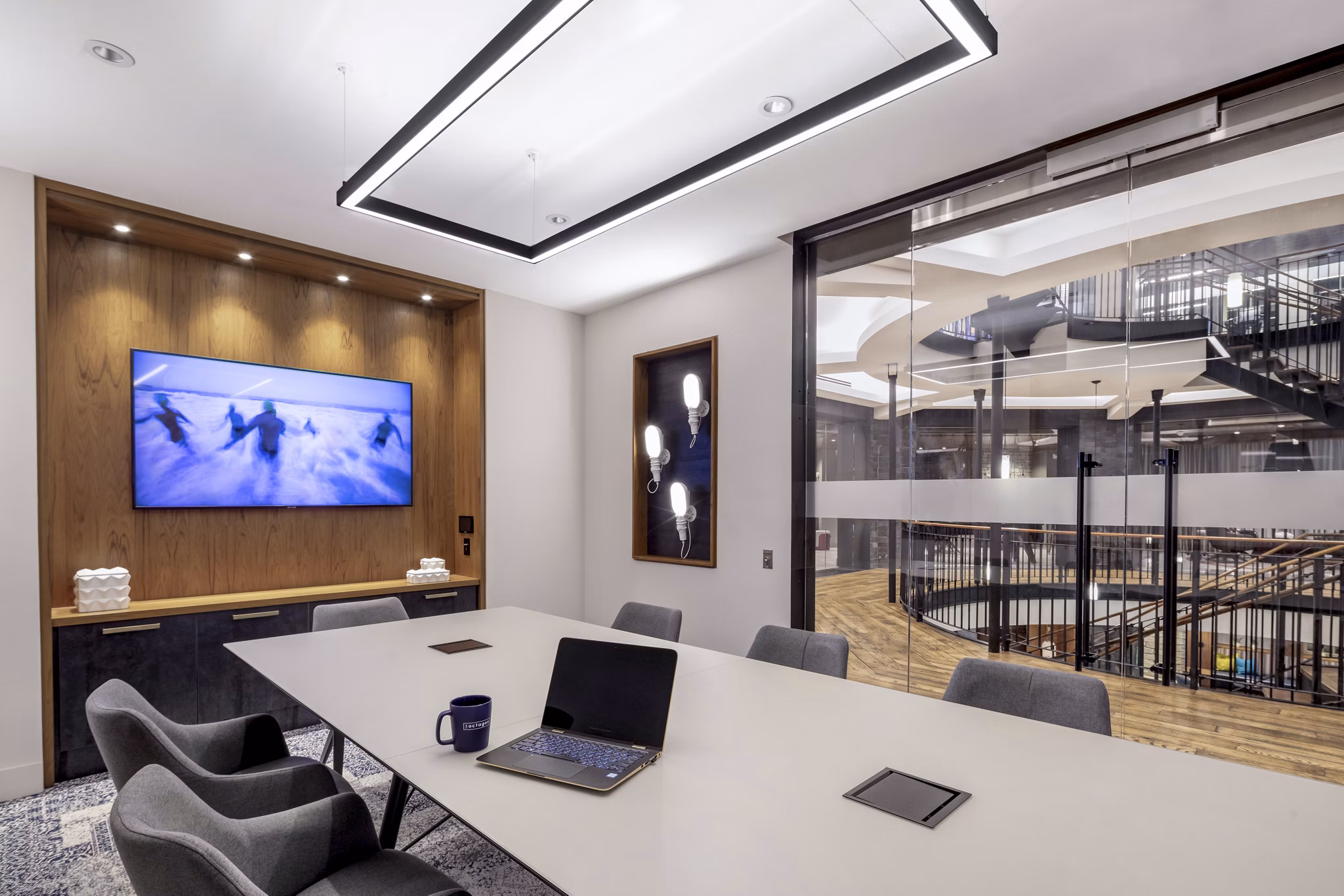 The Octagon Apartments: Modern clubhouse business center with sleek design and technology in a luxury setting