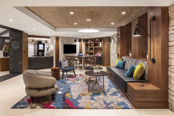 Stylish clubhouse featuring modern decor at The Octagon Apartments, a luxury Greystar community in NYC