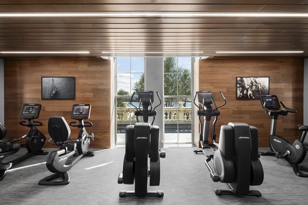 Spacious fitness center with modern equipment at The Octagon Apartments