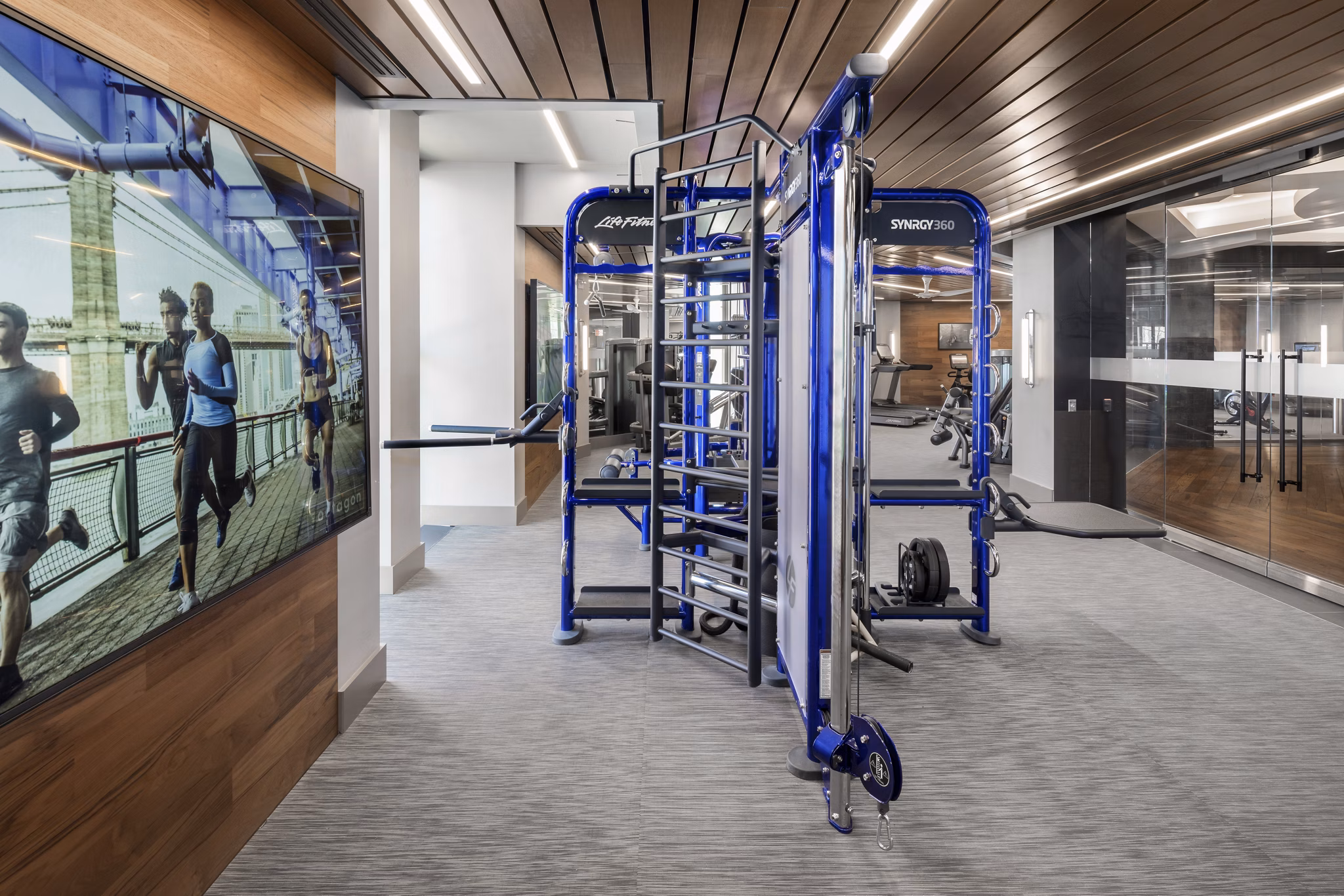 State-of-the-art fitness center at The Octagon Apartments with modern equipment and spacious workout area, perfect for luxury living