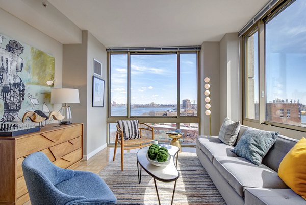 Spacious living room with modern decor at The Octagon Apartments in New York City