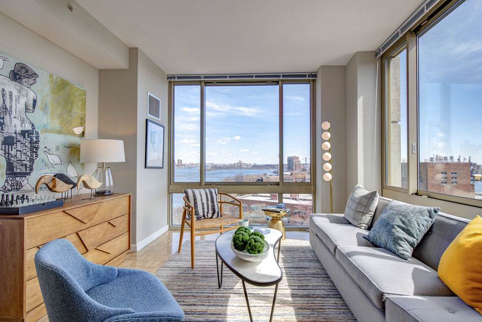 Spacious living room with modern decor at The Octagon Apartments in New York City