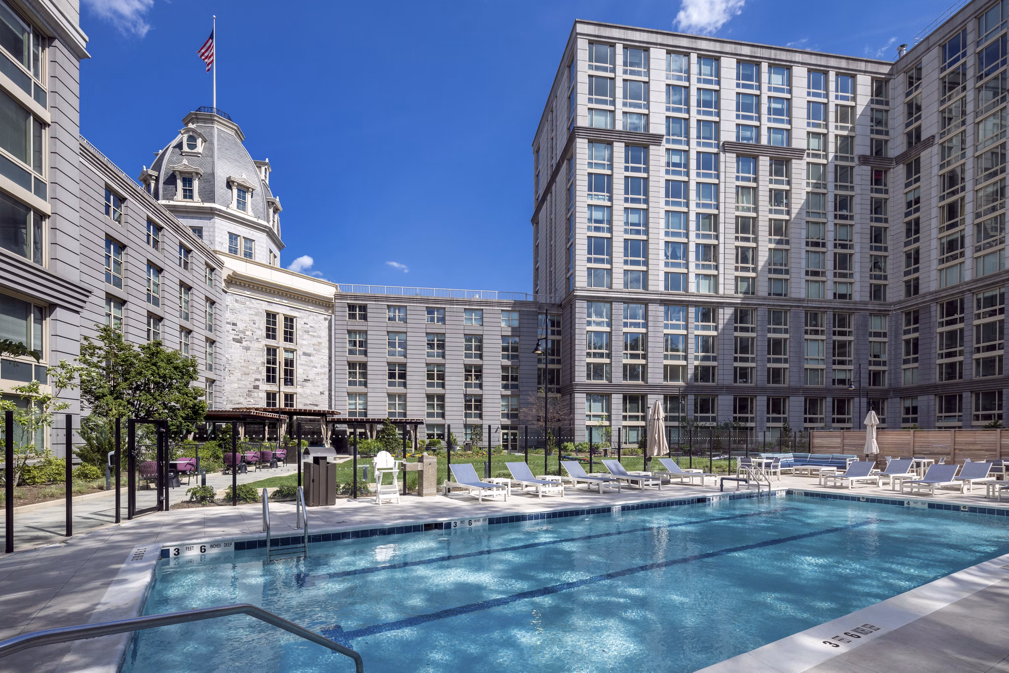 Outdoor pool with cityscape views at The Octagon Apartments