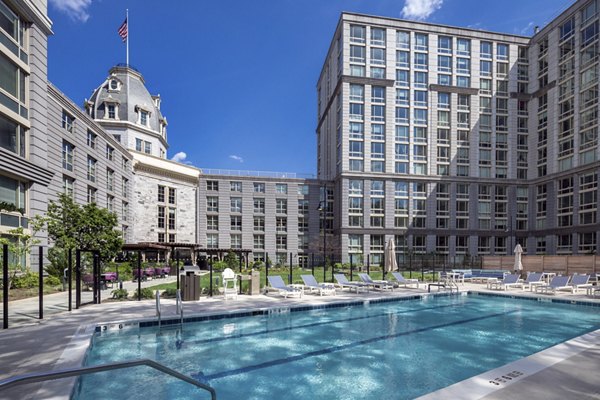 Outdoor pool with cityscape views at The Octagon Apartments