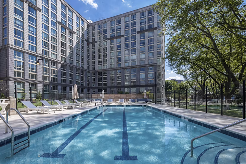 Rooftop pool with panoramic skyline views at The Octagon Apartments