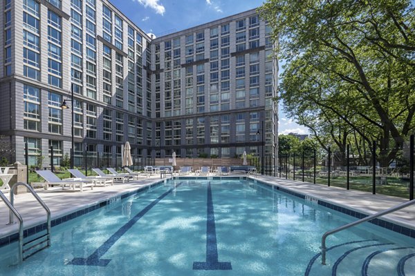 Rooftop pool with panoramic skyline views at The Octagon Apartments