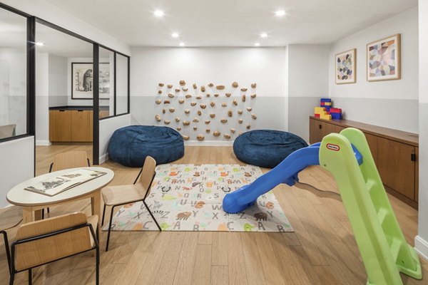 Modern clubhouse featuring luxurious seating and entertainment spaces at Oriana Apartments