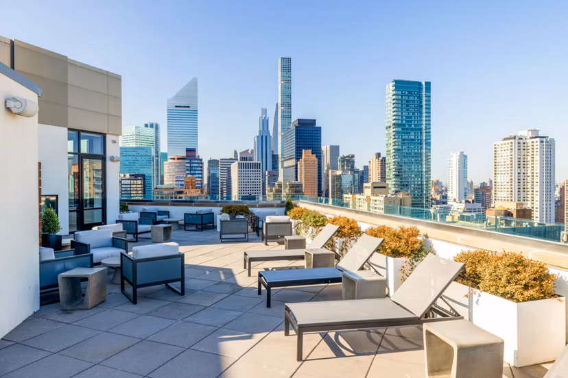 Scenic rooftop deck with stylish seating at Oriana Apartments, offering luxury living in a prime urban location