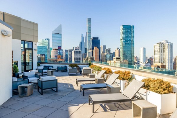 Scenic rooftop deck with stylish seating at Oriana Apartments, offering luxury living in a prime urban location