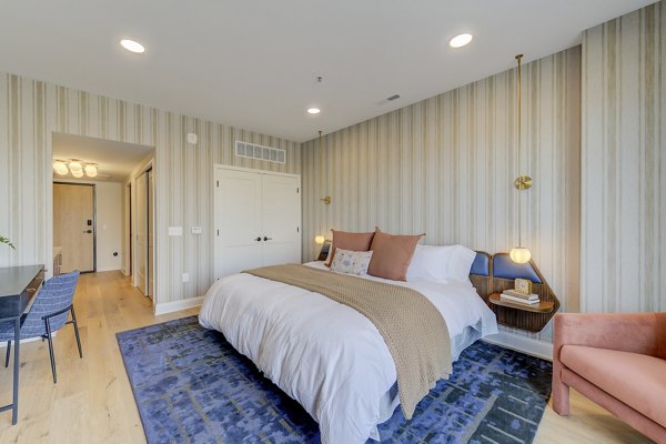 Cozy bedroom with contemporary design at The James Apartments