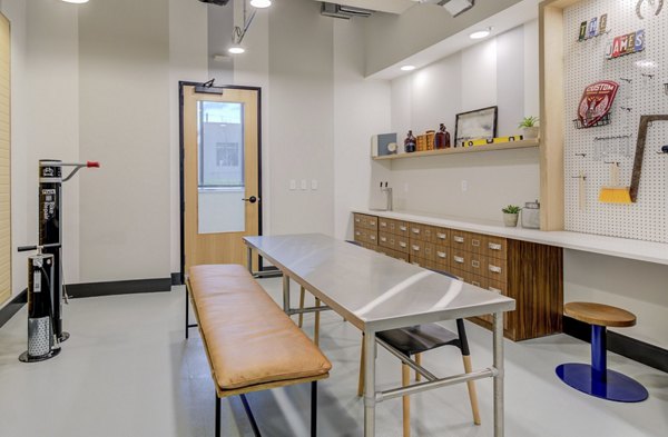 Clubhouse featuring contemporary design and comfortable seating areas at The James Apartments, ideal for social gatherings