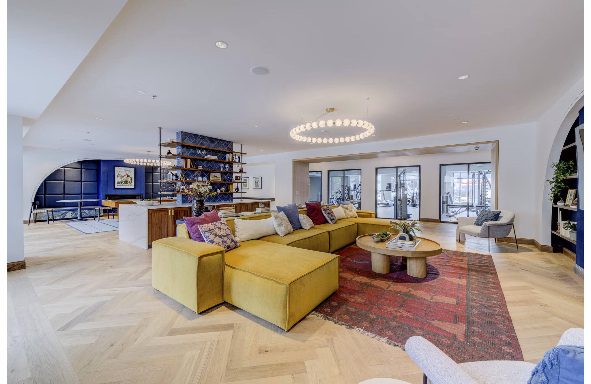 Clubhouse featuring modern furnishings and entertainment spaces at The James Apartments