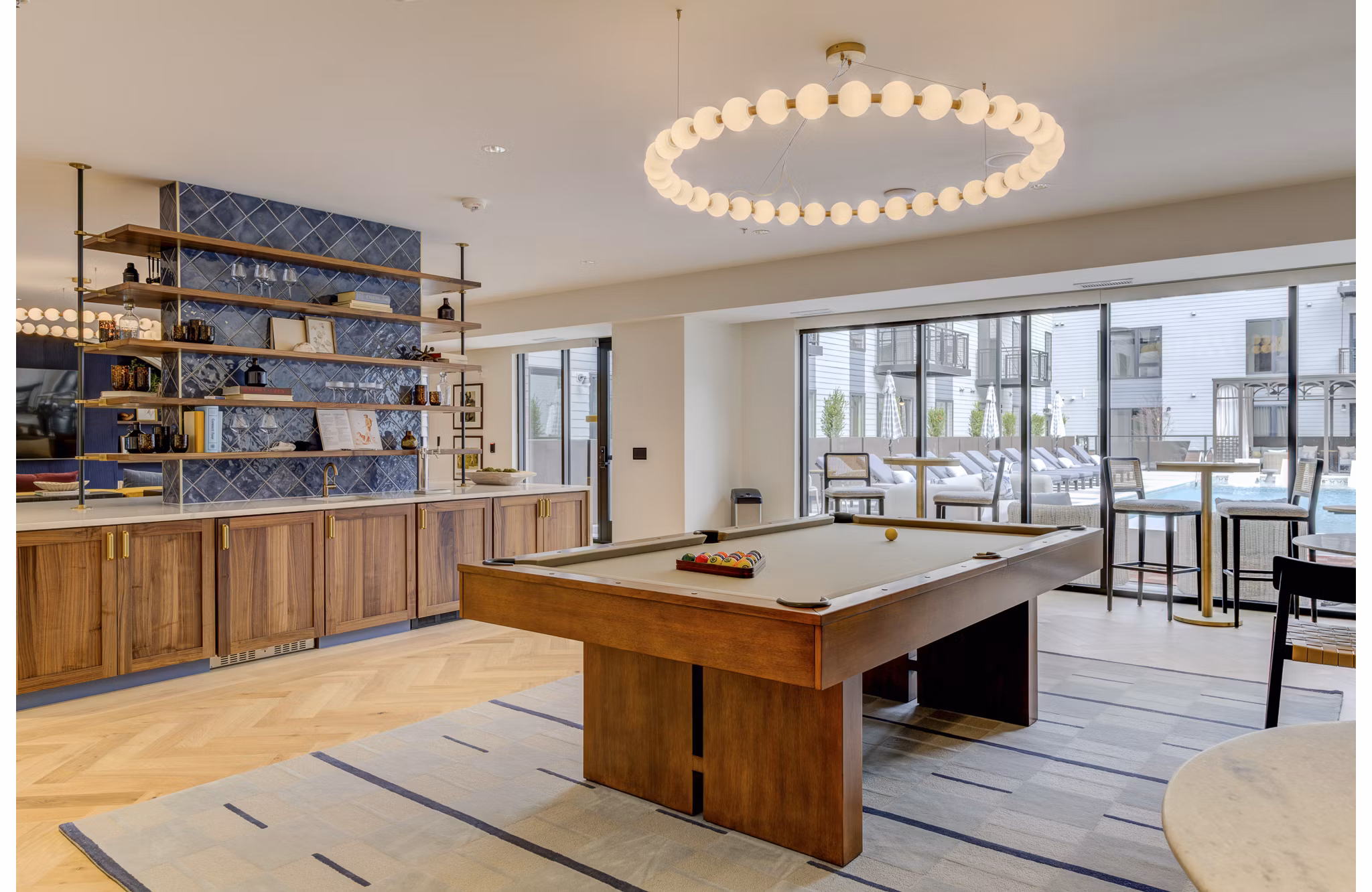 Elegant clubhouse with modern furnishings at The James Apartments, offering a luxurious space for residents to relax and socialize