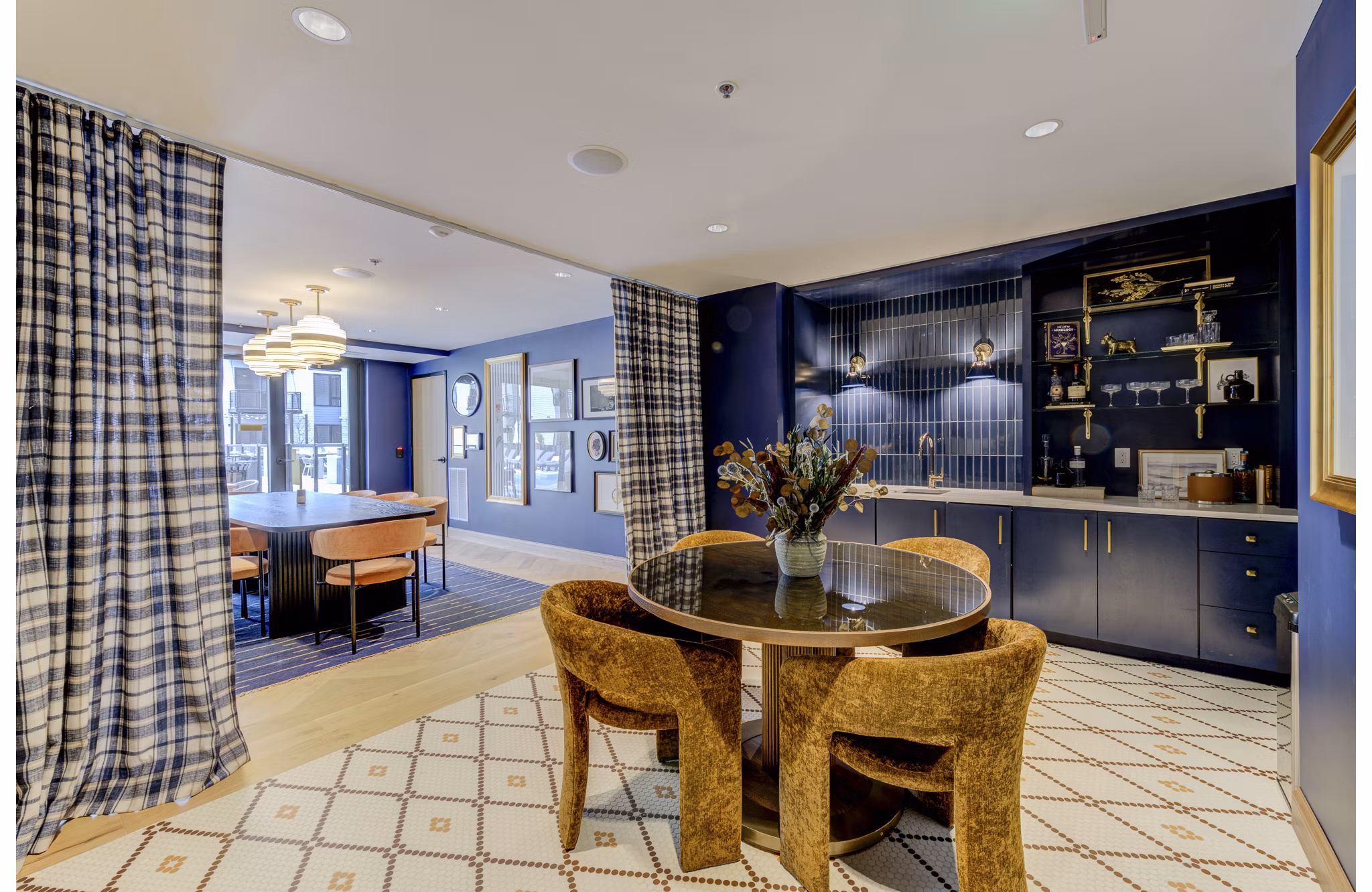 Elegant clubhouse with modern decor and seating at The James Apartments, ideal for hosting residents and social gatherings