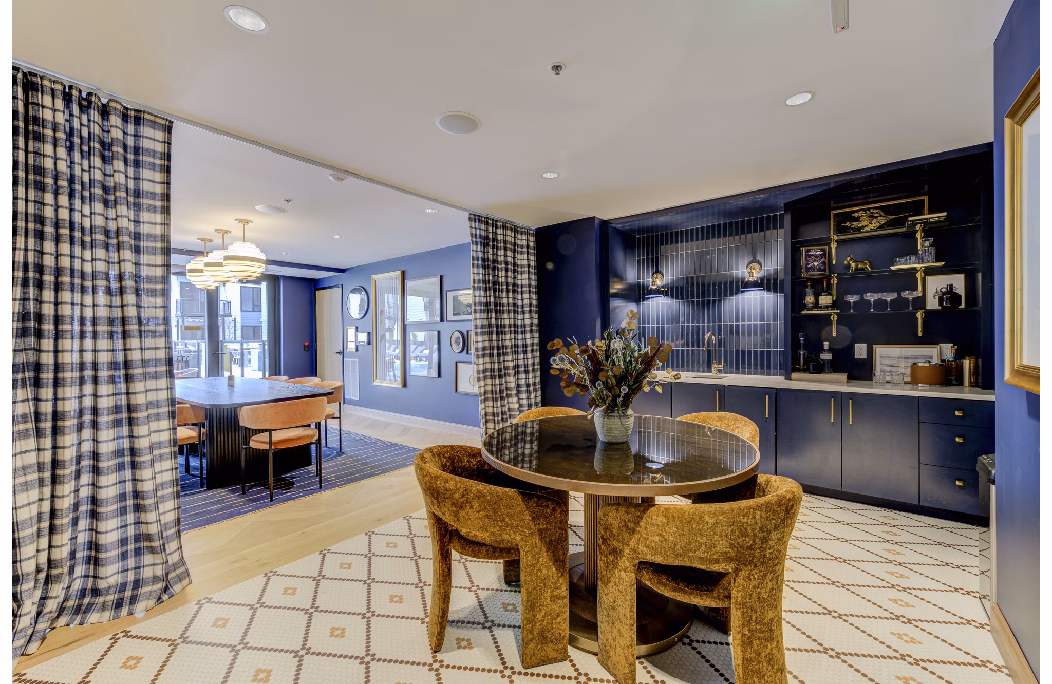 Elegant clubhouse with modern decor and seating at The James Apartments, ideal for hosting residents and social gatherings