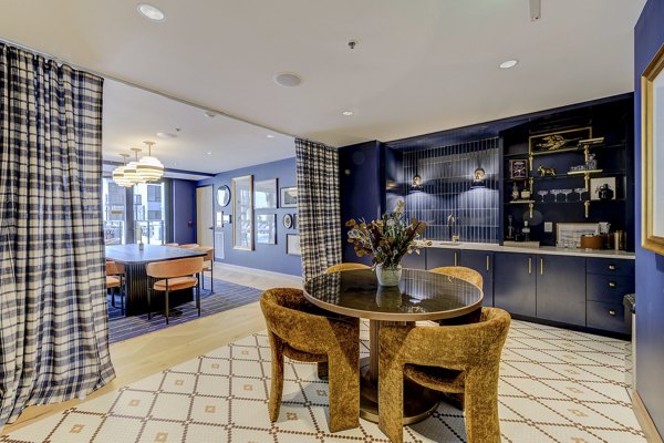 Elegant clubhouse with modern decor and seating at The James Apartments, ideal for hosting residents and social gatherings