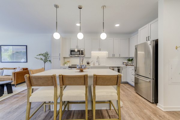 Dining area featuring modern decor and elegant lighting at The James Apartments in luxury living environment