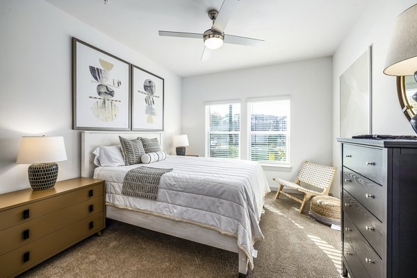 Bedroom featuring modern design and natural light at Arlow at Blue Ridge Apartments
