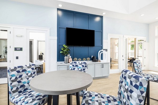 Clubhouse with chic decor and cozy seating at Arlow at Blue Ridge Apartments