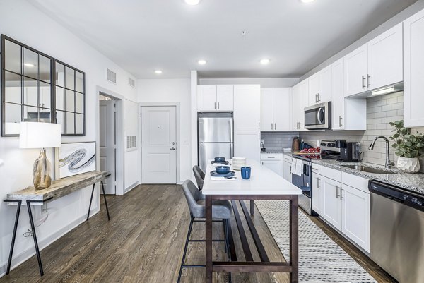 Arlow at Blue Ridge Apartments: Modern kitchen with stainless steel appliances and granite countertops
