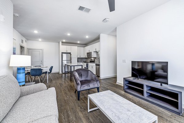 Cozy living room with modern dÃ©cor and natural light at Arlow at Blue Ridge Apartments