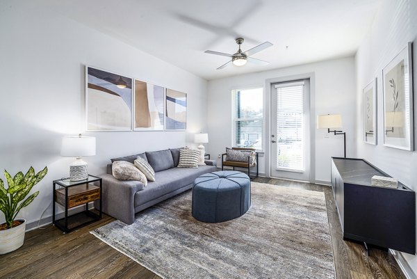 Spacious living room with modern decor and natural light in Arlow at Blue Ridge Apartments