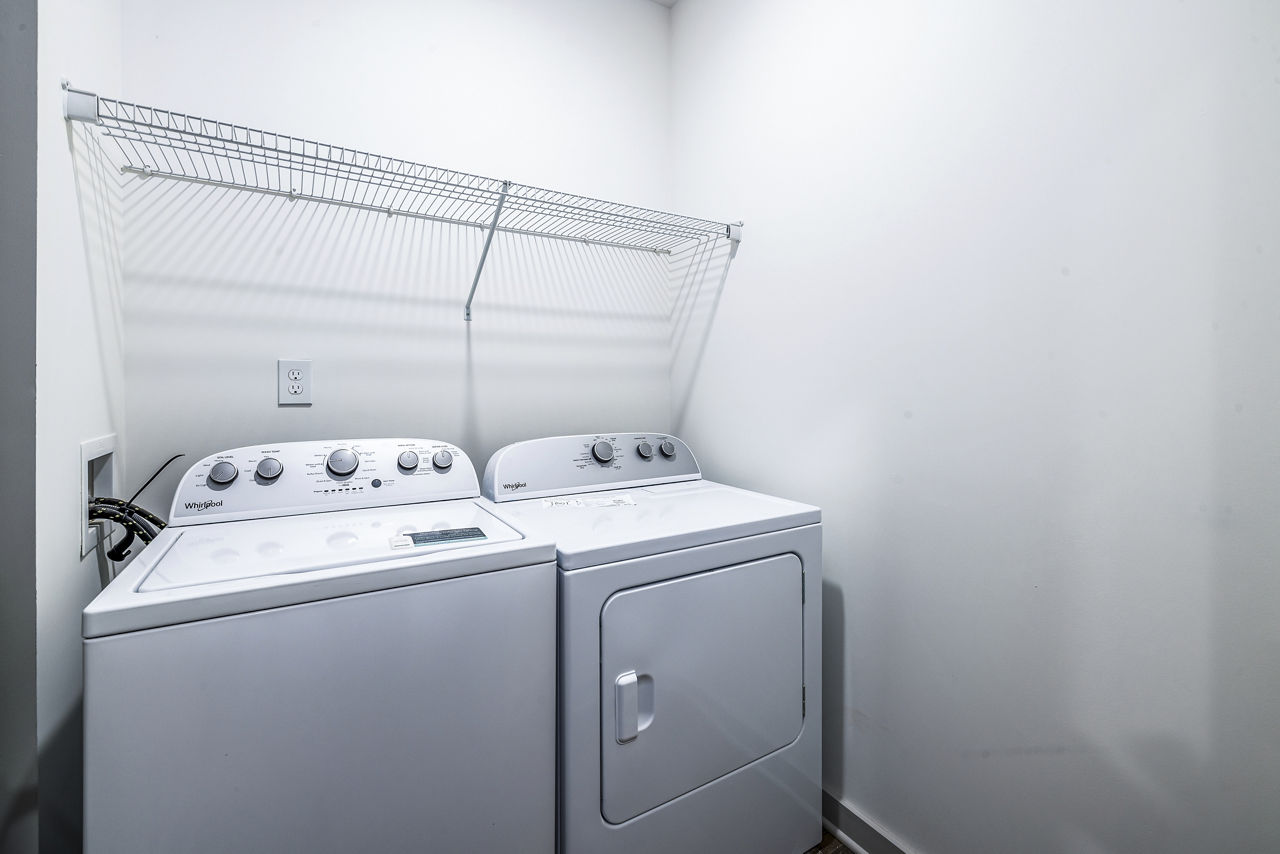 Laundry room at Arlow At Blue Ridge Apartments