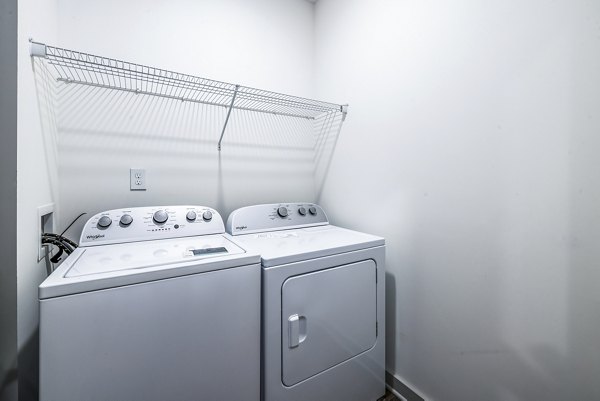 Laundry room with modern appliances in Arlow at Blue Ridge Apartments