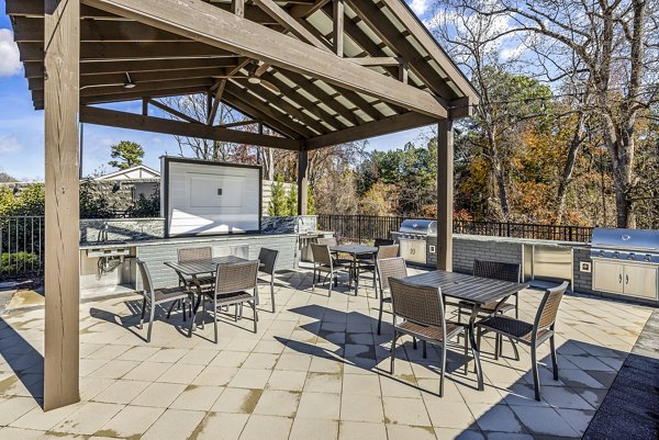 Outdoor grill and dining patio at Arlow at Blue Ridge Apartments, perfect for social gatherings and relaxation