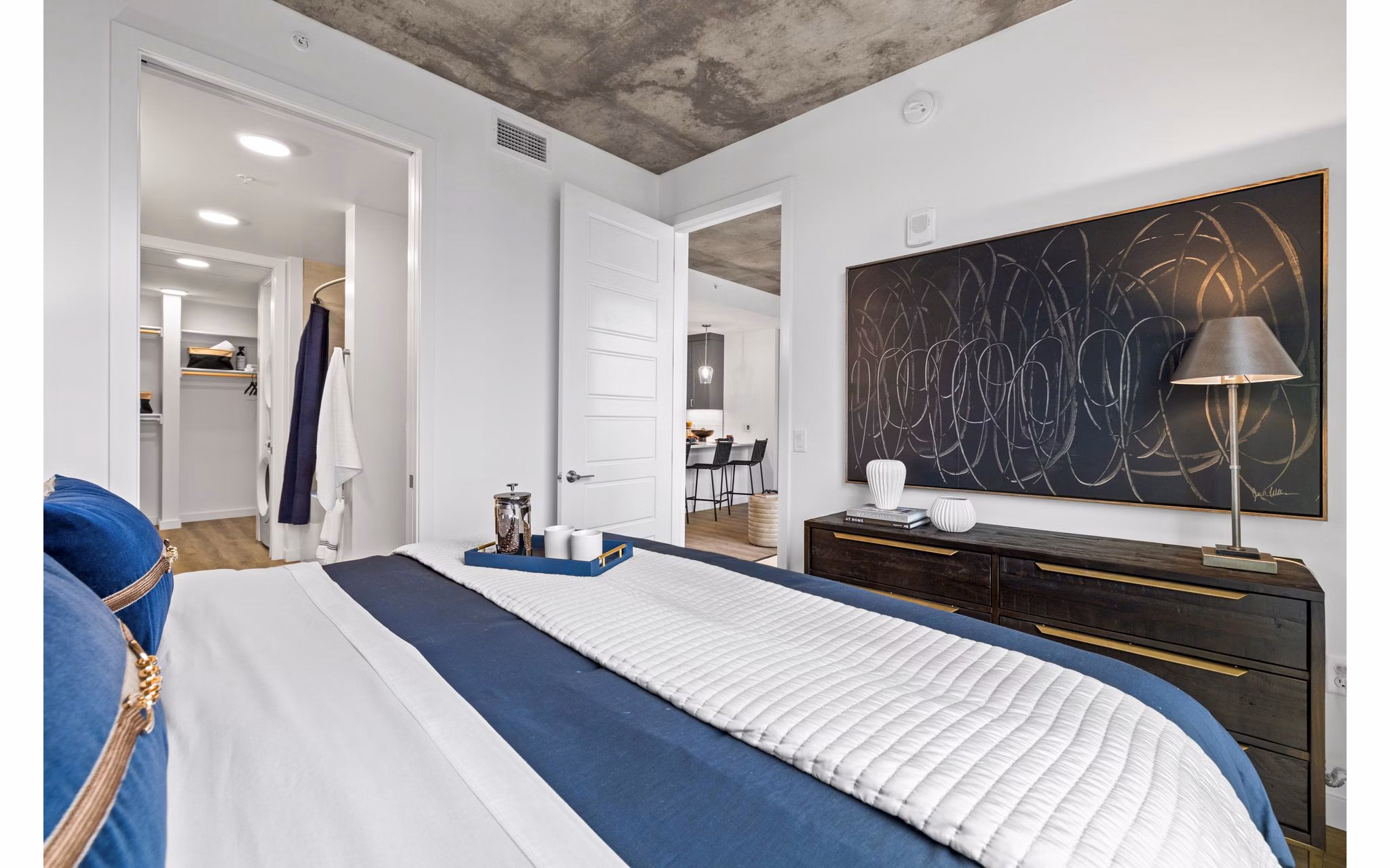 Spacious bedroom with modern furnishings in Willamette Tower Apartments