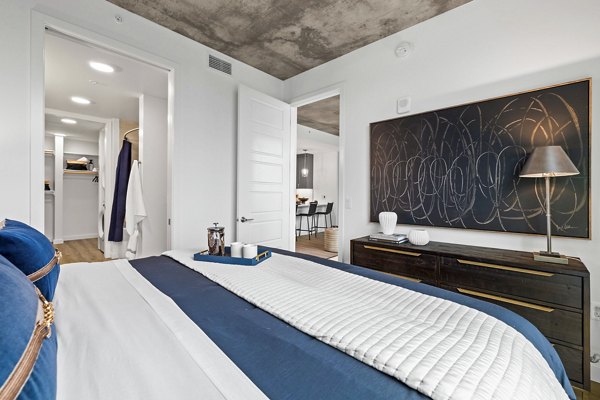 Spacious bedroom with modern furnishings in Willamette Tower Apartments