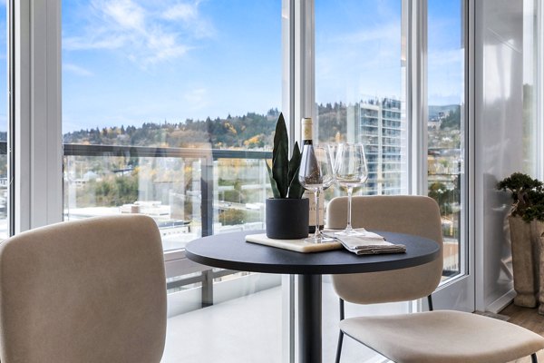 Dining room with modern furnishings at Willamette Tower Apartments featuring sleek table and chairs in Greystar's luxury apartments