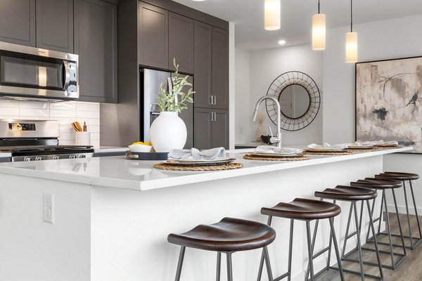 Modern kitchen with stainless steel appliances at Willamette Tower Apartments