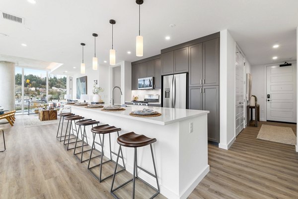 Modern kitchen featuring stainless steel appliances in Willamette Tower Apartments