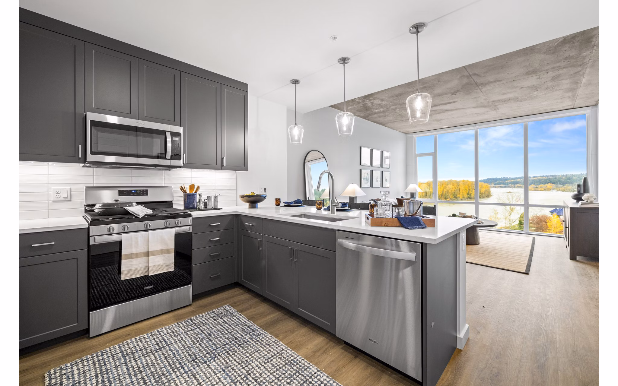 Modern kitchen with stainless steel appliances at Willamette Tower Apartments in Seattle