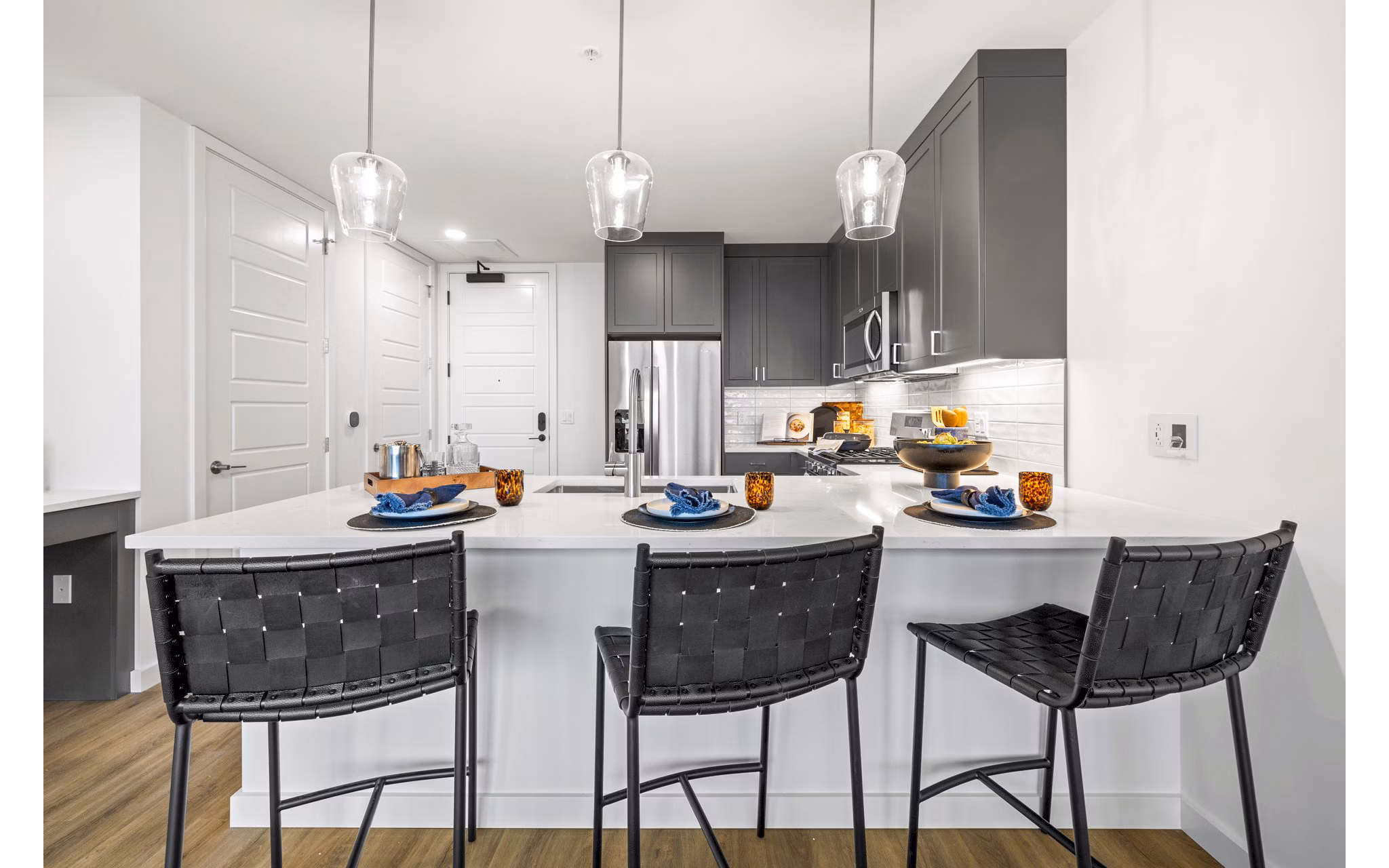 Modern kitchen with stainless steel appliances in Willamette Tower Apartments