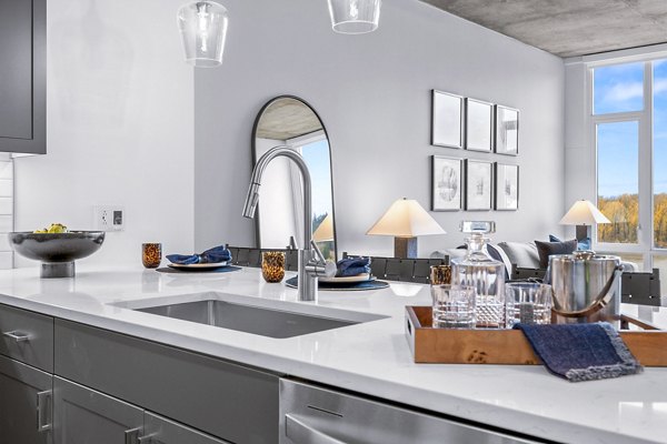 Modern kitchen with stainless steel appliances in Willamette Tower Apartments