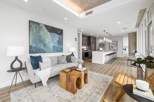 Spacious living room with modern decor in Willamette Tower Apartments
