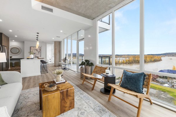 Spacious living room with modern decor in Willamette Tower Apartments
