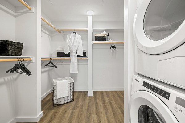 Closet and laundry room with modern storage solutions at Willamette Tower Apartments