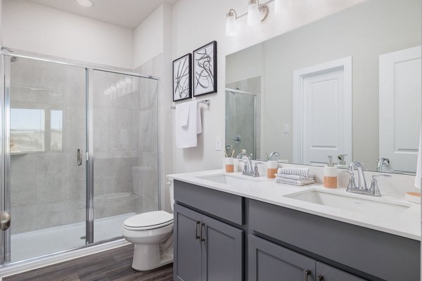 Modern bathroom with sleek fixtures at Caso University Heights Apartments