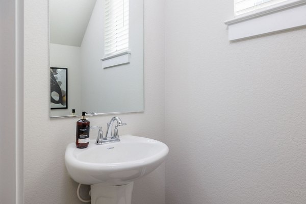 Bathroom featuring elegant fixtures and modern design at Caso University Heights Apartments